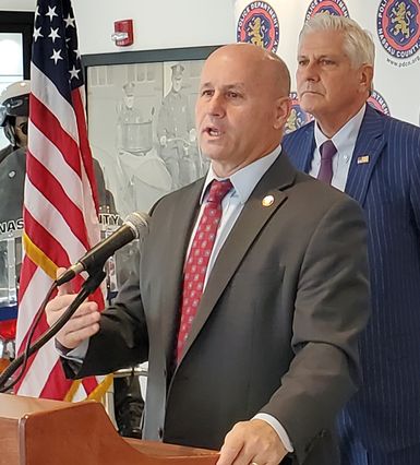 Nassau County Police Commissioner Patrick Ryder speaks as Bruce Blakeman, the newly sworn-in county executive, looks on. (Charles Lane/WSHU)